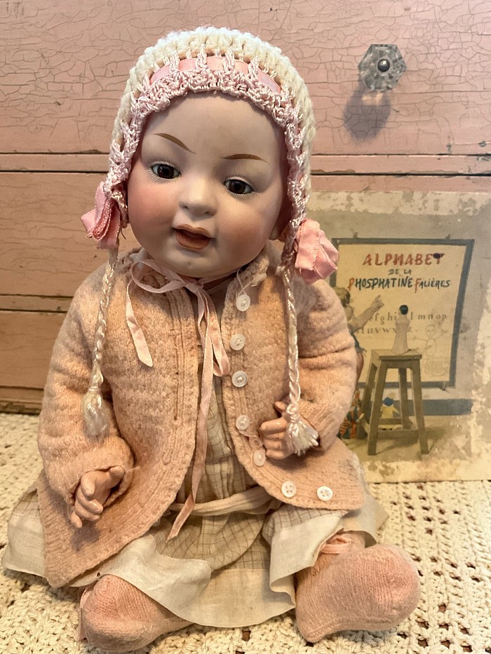 16” Kestner baby incised only “ 12” . Sweet chocolate brown eyes and chubby cheeks. Wearing oodles of fabulous antique clothing from head to toe. $599.00 postage paid