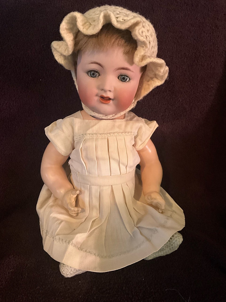 Antique Kammer * Reinhardt 126 bisque head baby doll. A darling doll with a cherub like appearance. Original body in wonderful shape. Wearing an antique dress, knit booties & bonnet. Blue sleep eyes retain some of their mohair lashes. A 16” cutie who is ready to display. ~ $75
