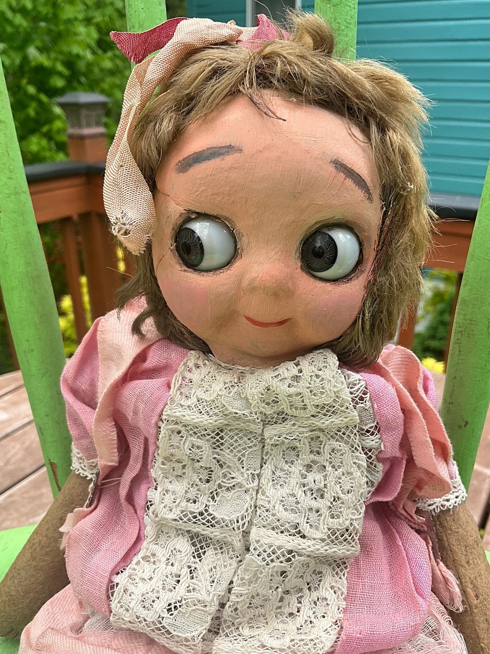 12” German Hug Me Kiddie. Crack near right eye, lovely face repainting and full original mohair wig. Darling antique pink dress and ribbons in hair. ~ $395