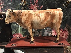 early hide cow on wheels, $250 please  inquire for info